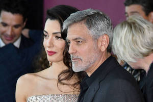 Bild von George und Amal Clooney